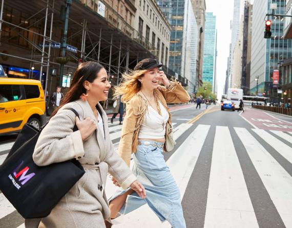 Two female LIM students cross 42nd St. near Grand Central Terminal in midtown New York City