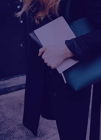 A people holding papers while walking.