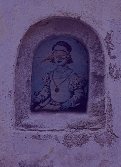 A drawing of a woman on an old wall.
