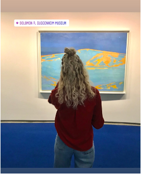 Girl looking at Art