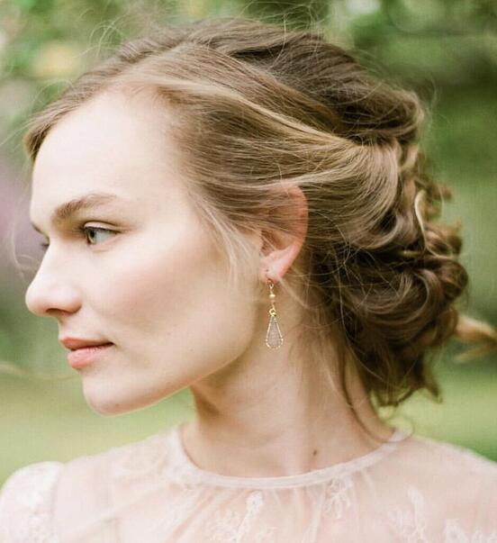 Side view of a woman featuring an earring