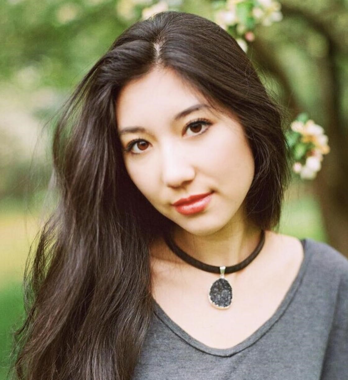 Woman looking at camera wearing a choker necklace