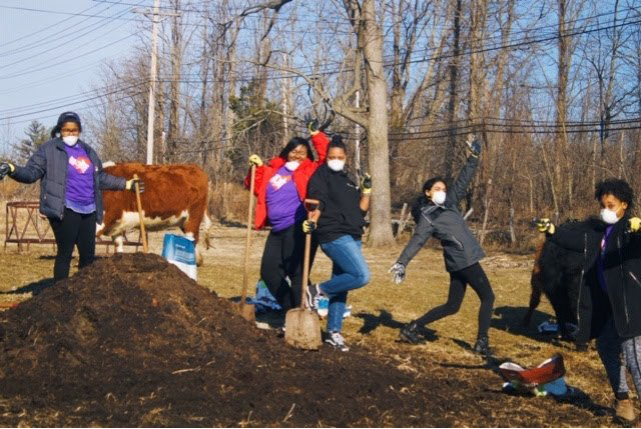 spring break group doing community work at a farm