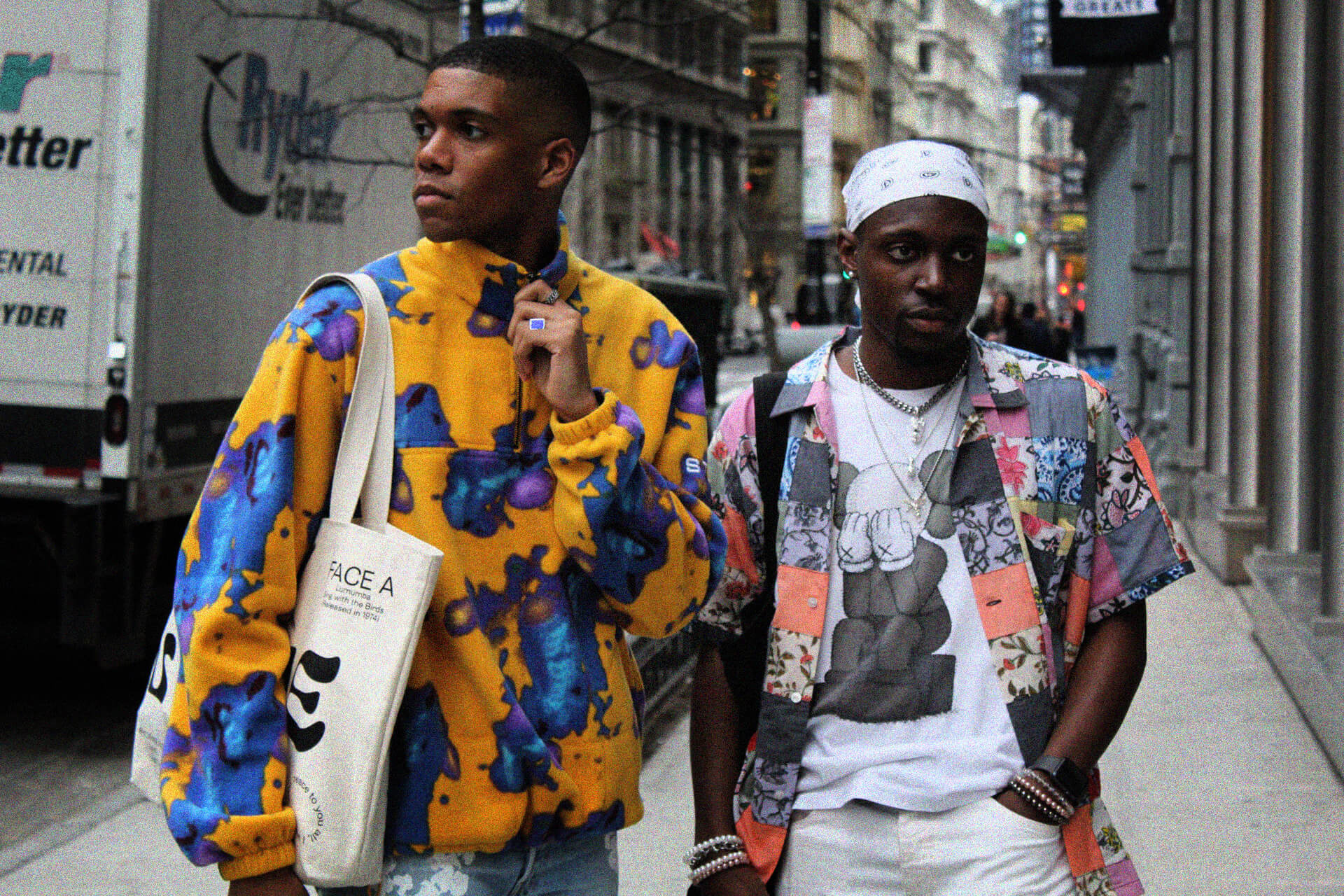 two men in brighly colored shirts on the streets of NYC