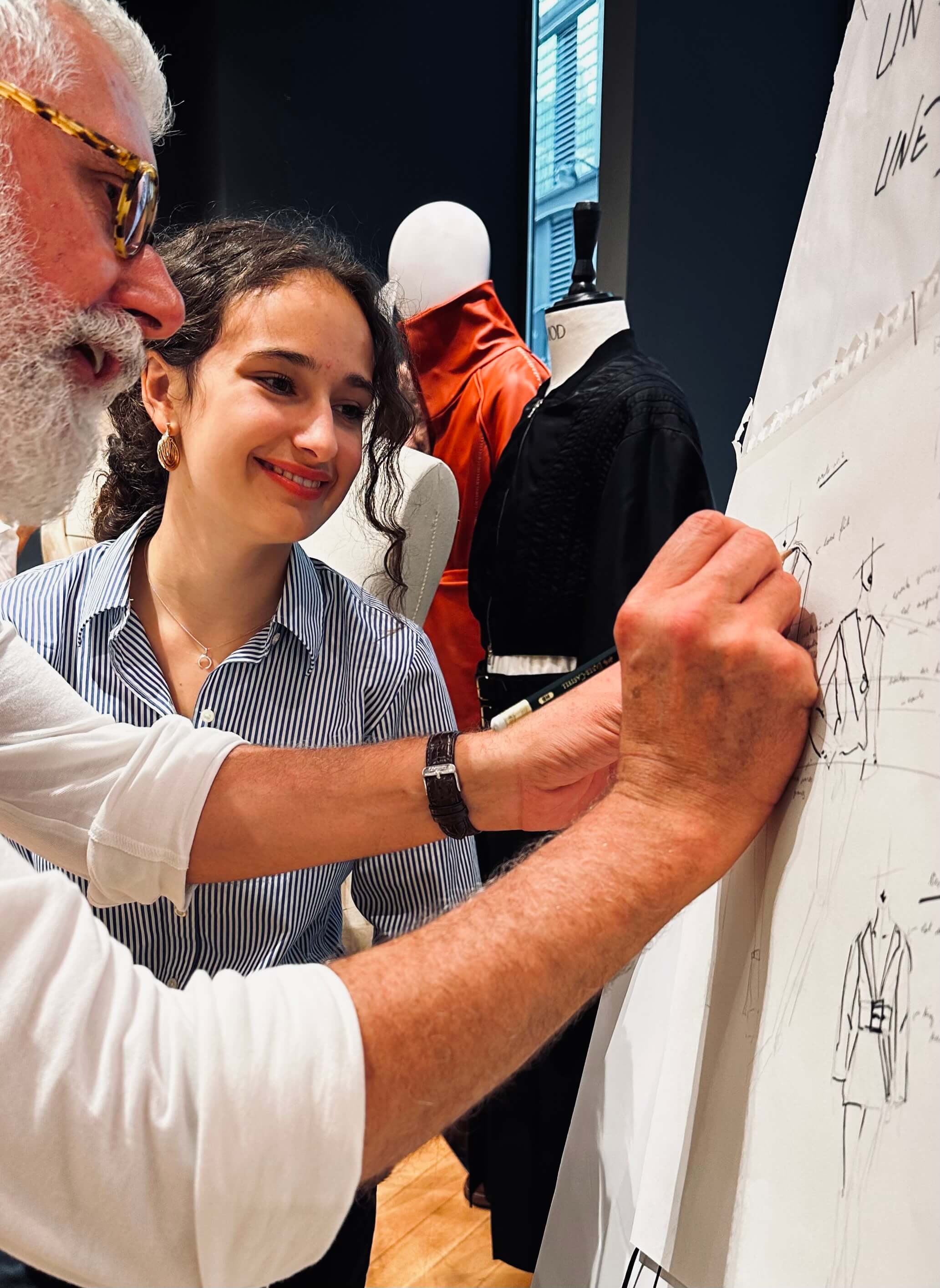 Design professor with student, white design pad