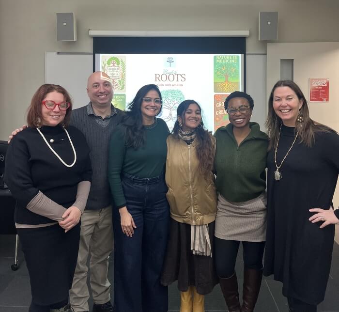 LIM graduate students with professor in classroom