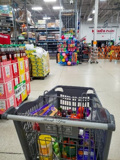 big grocery store, shopping cart in foreground 