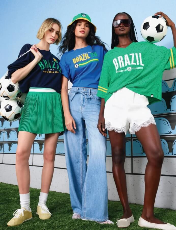 three models dressed casually holding soccer balls