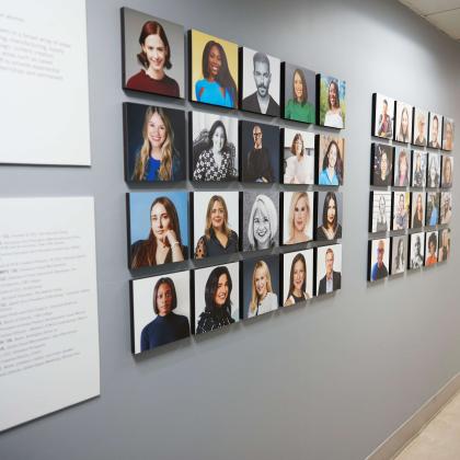 wall display showcasing profile picutres of alumni