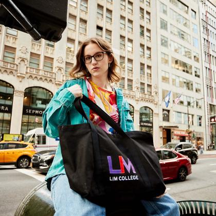 female student with glasses and LIM bag on Fifth Ave