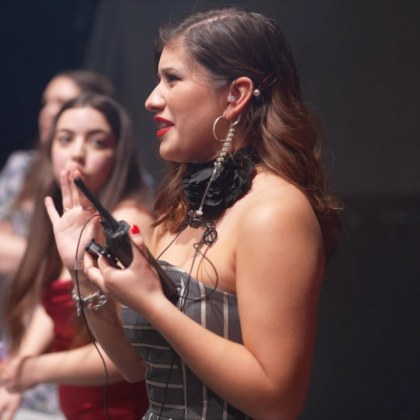 students behind the scenes working the LIM student-run fashion show