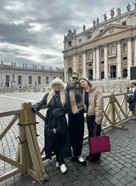 3 girls posing in front of a building