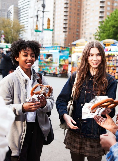 girls in a group eating pretzels