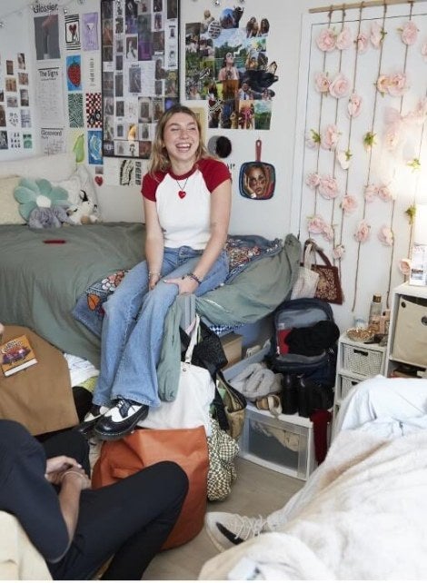 Students sitting and laughing in FOUND Residence Hall