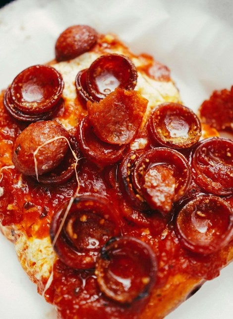 pepperoni pizza on a paper plate