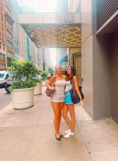 2 girls in front of 545 5th ave building