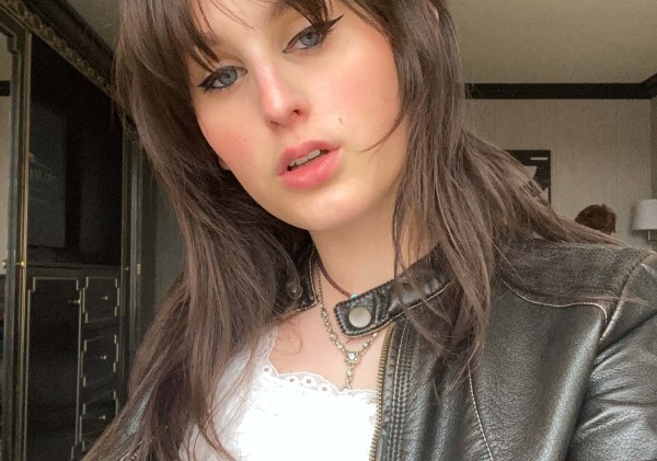 woman with brown hair in leather jacket, medium closeup