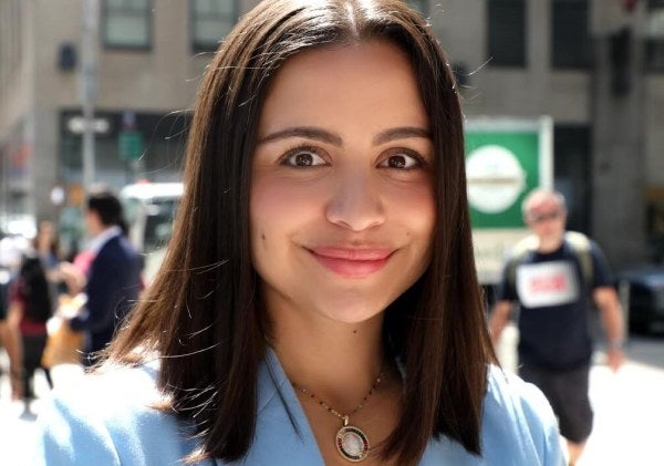young woman, new york city street, professional headshot, light-blue jacket