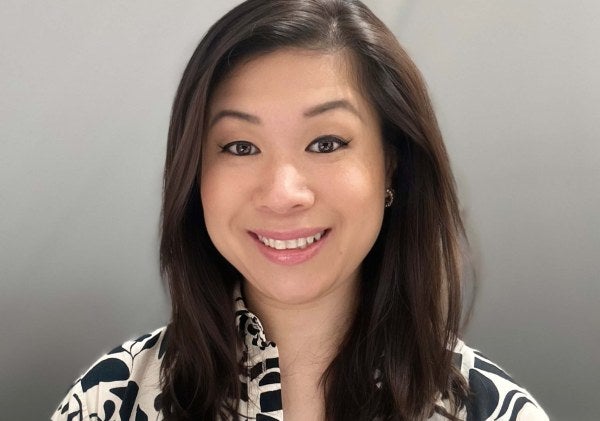 Kristina Chu DeJesus professional headshot, black-and-white patterned blouse