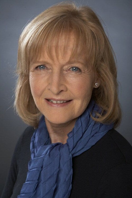 headshot of a woman wearing a scarf