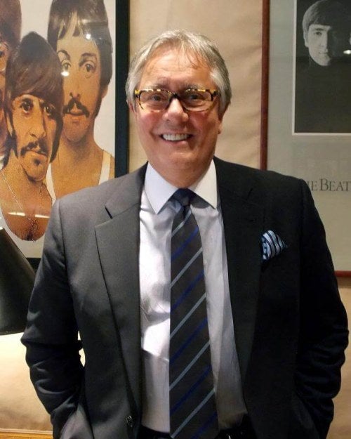 photo of a man wearing glasses, smiling