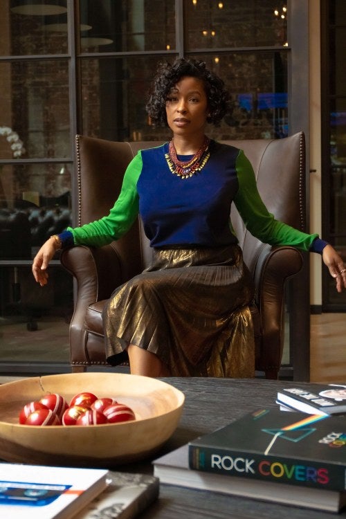 woman sitting with crossed legs in a chair