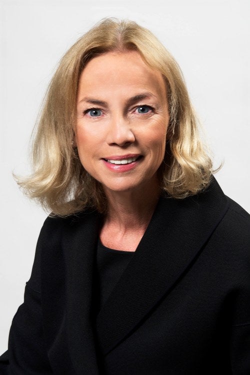 headshot of a woman with a white background