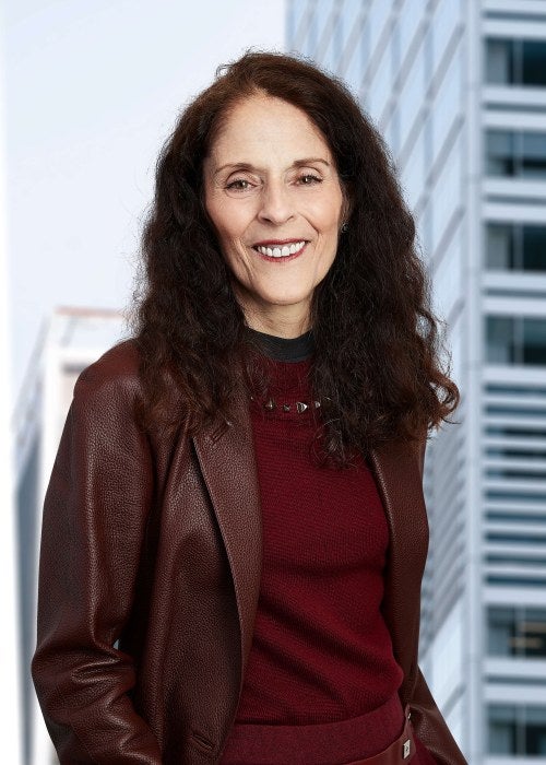 woman in brown blazer and matching top