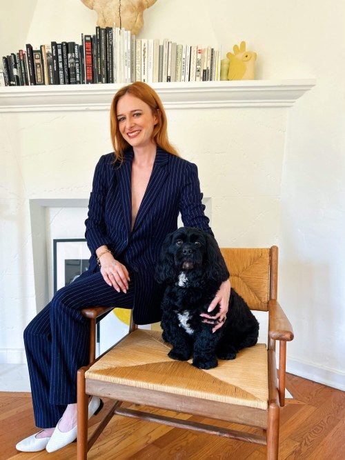 photo of a woman sitting with her dog