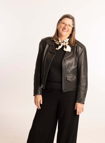 Professor Mitropoulos in leather jacket, white backdrop