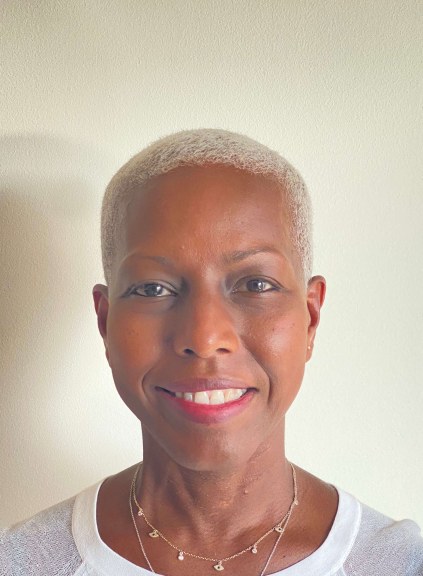 headshot of a woman in front of white background