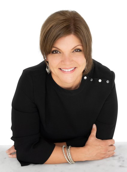 woman leaning on her elbows in front of white background