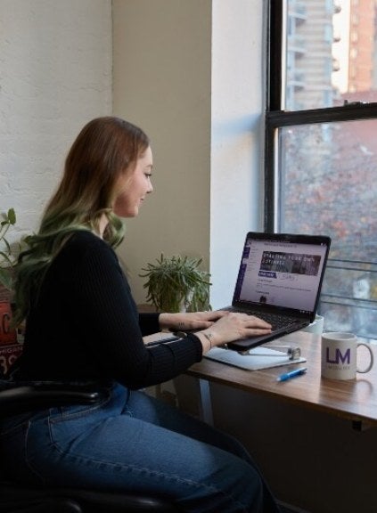 woman with red hair on laptop, LIM mug