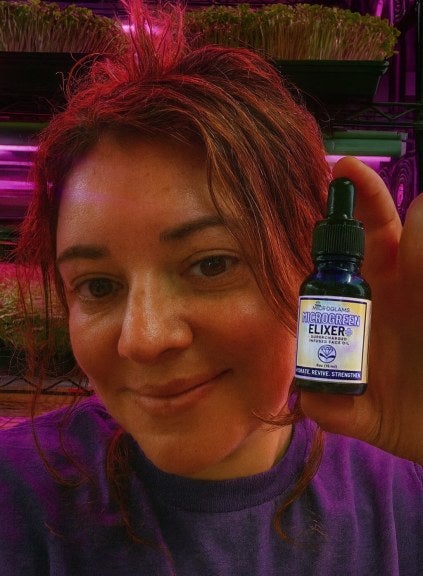 Gloria Cherny holds Microglams product, dropper bottle