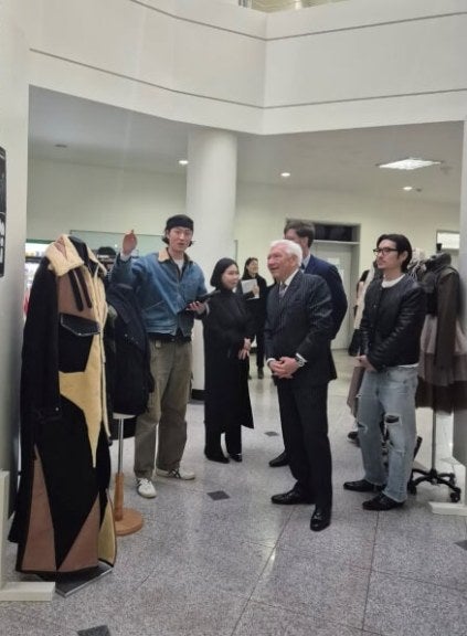 Several people at University of Suwon design room, including LIM President Ron Marshall