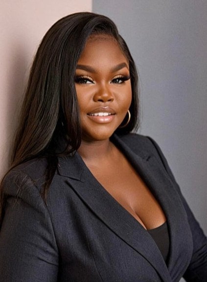 woman with long dark hair, earrings, charcoal business suit, medium shot