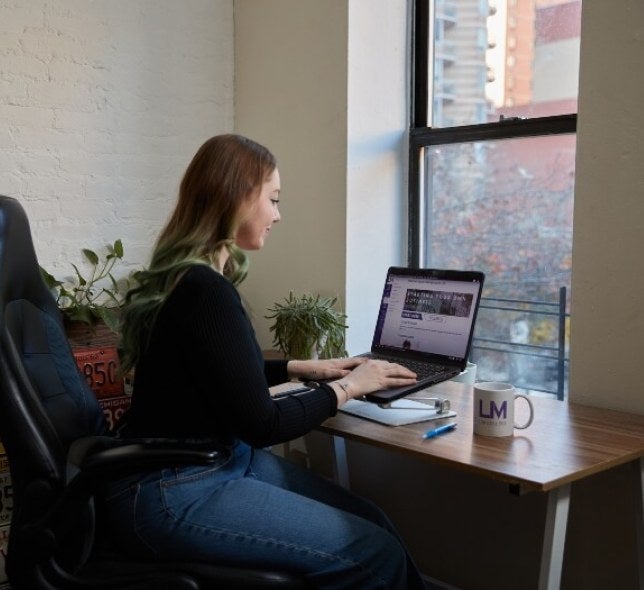 woman with red hair on laptop, LIM mug