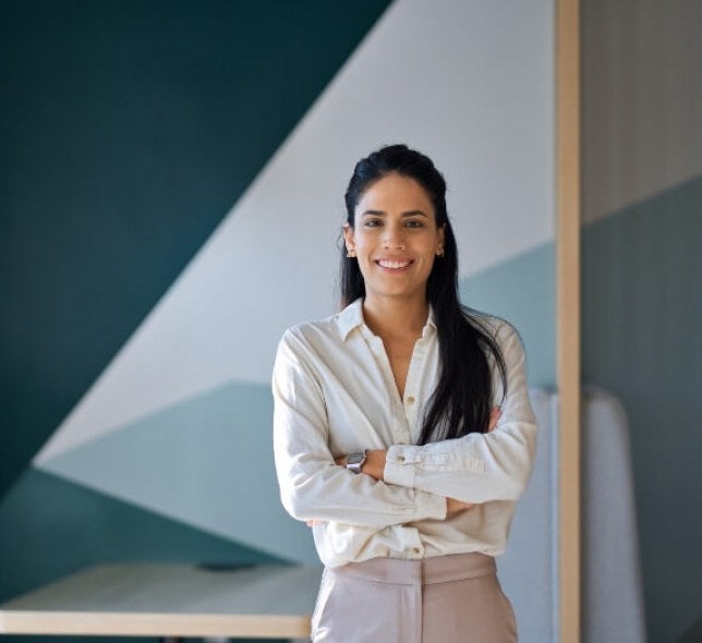 woman, long dark hair, arms folded, professional setting