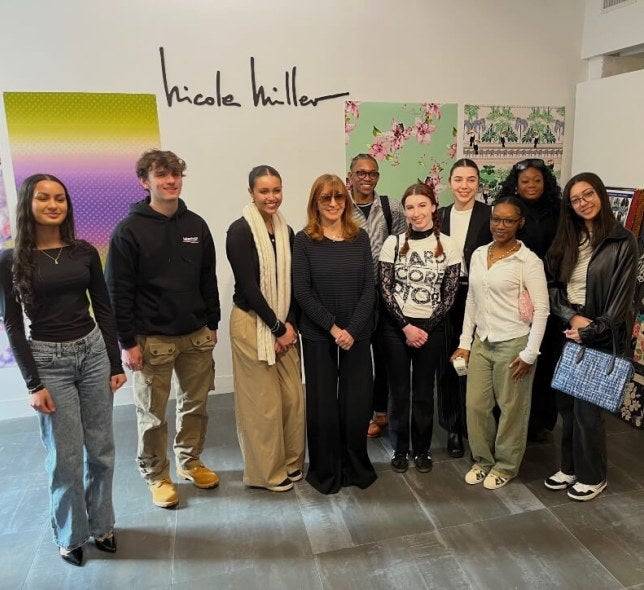 Nicole Miller with students in showroom
