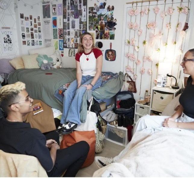 Students sitting and laughing in FOUND Residence Hall