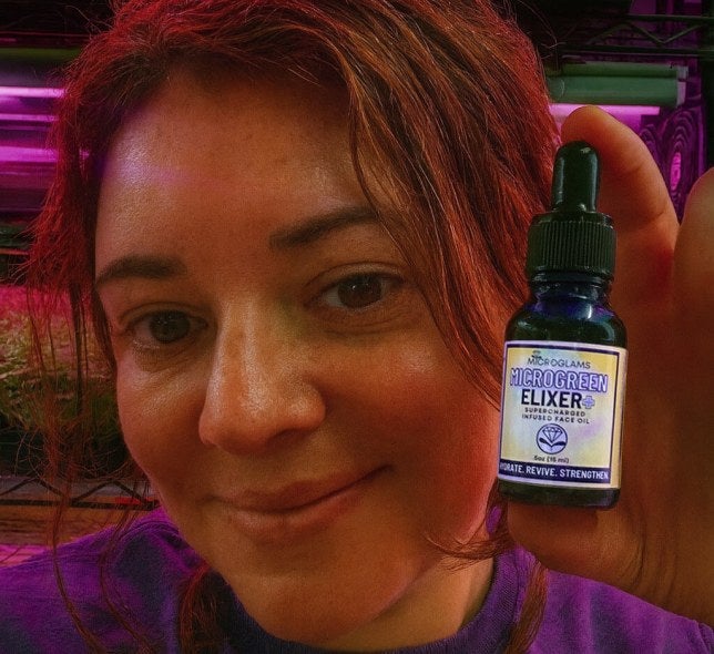 Gloria Cherny holds Microglams product, dropper bottle