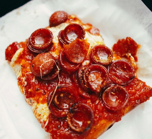 pepperoni pizza on a paper plate