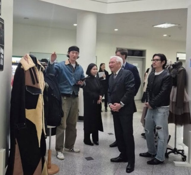 Several people at University of Suwon design room, including LIM President Ron Marshall