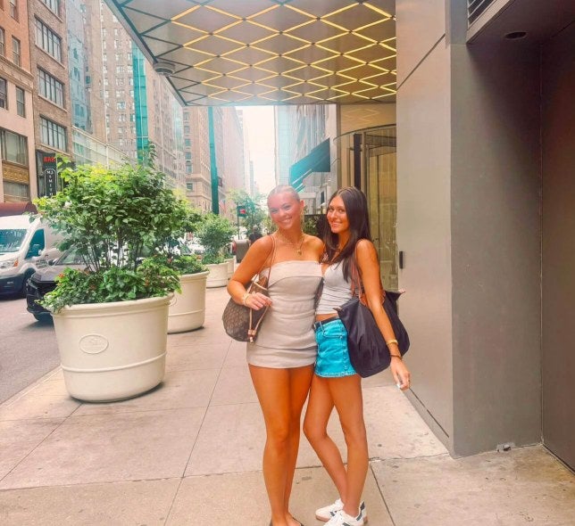 2 girls in front of 545 5th ave building