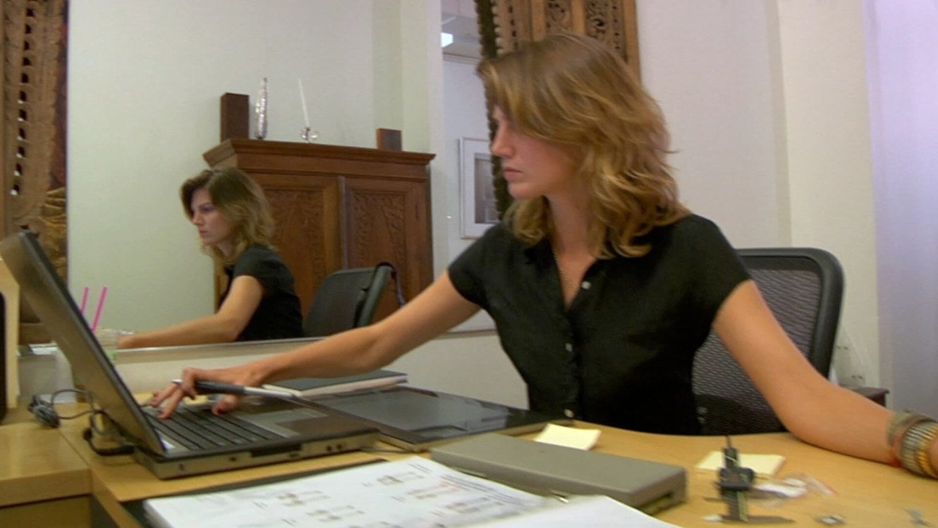 woman at desk using a laptop