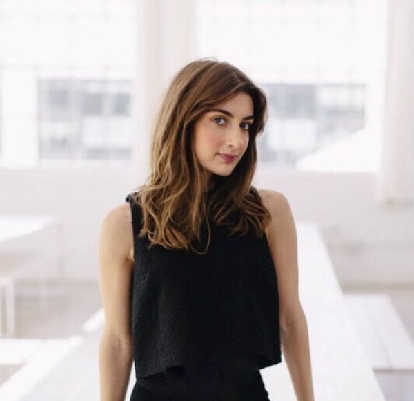 Lauren Gallo leaning on white table