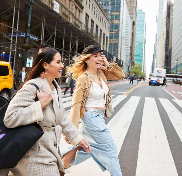 Two female LIM students cross 42nd St. near Grand Central Terminal in midtown New York City