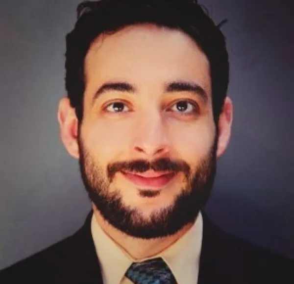man smiling staring right at camera