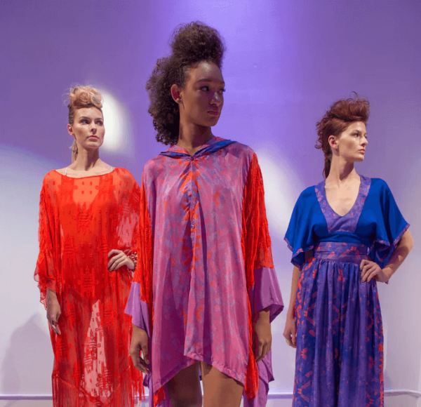 three models in dresses