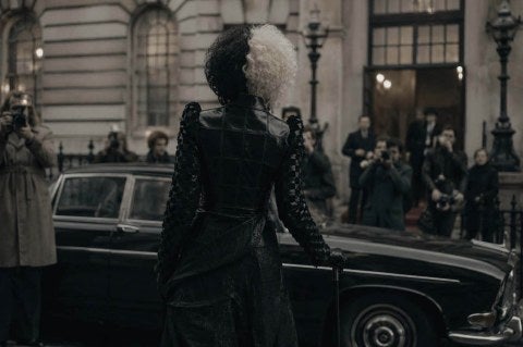 Cruella Deville outfit, black car, city building